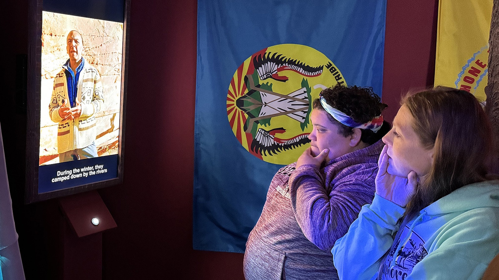 Visitors watch the testimonials included in the Medicine Lodge Cultural experience.