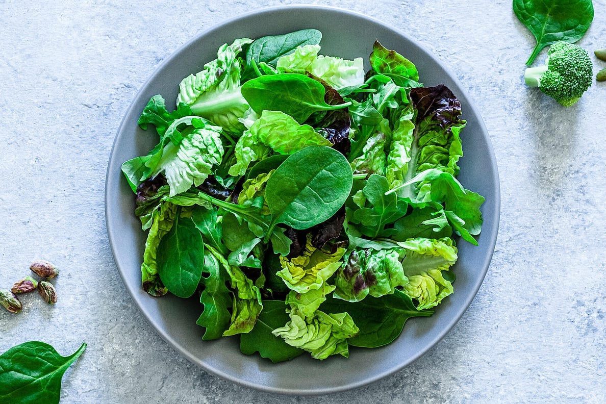 Adding dark leafy greens to your salad can help add variety to your diet.